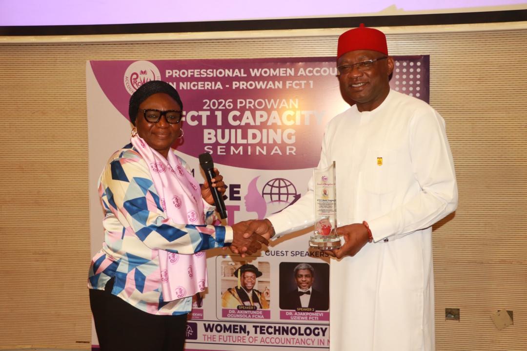 The Team lead receiving an award at the PROWAN 2026 Capacity Building Seminar